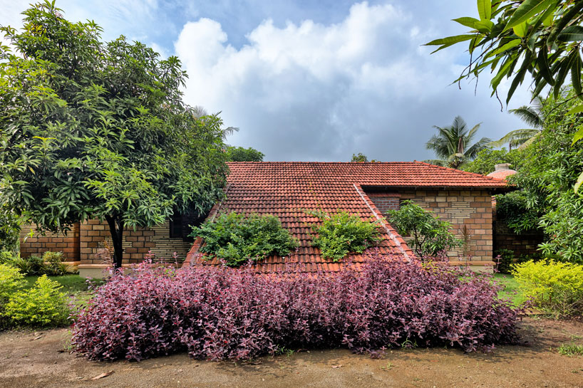 At a glance from front, sloping roof looks like it unites the earth and sky.