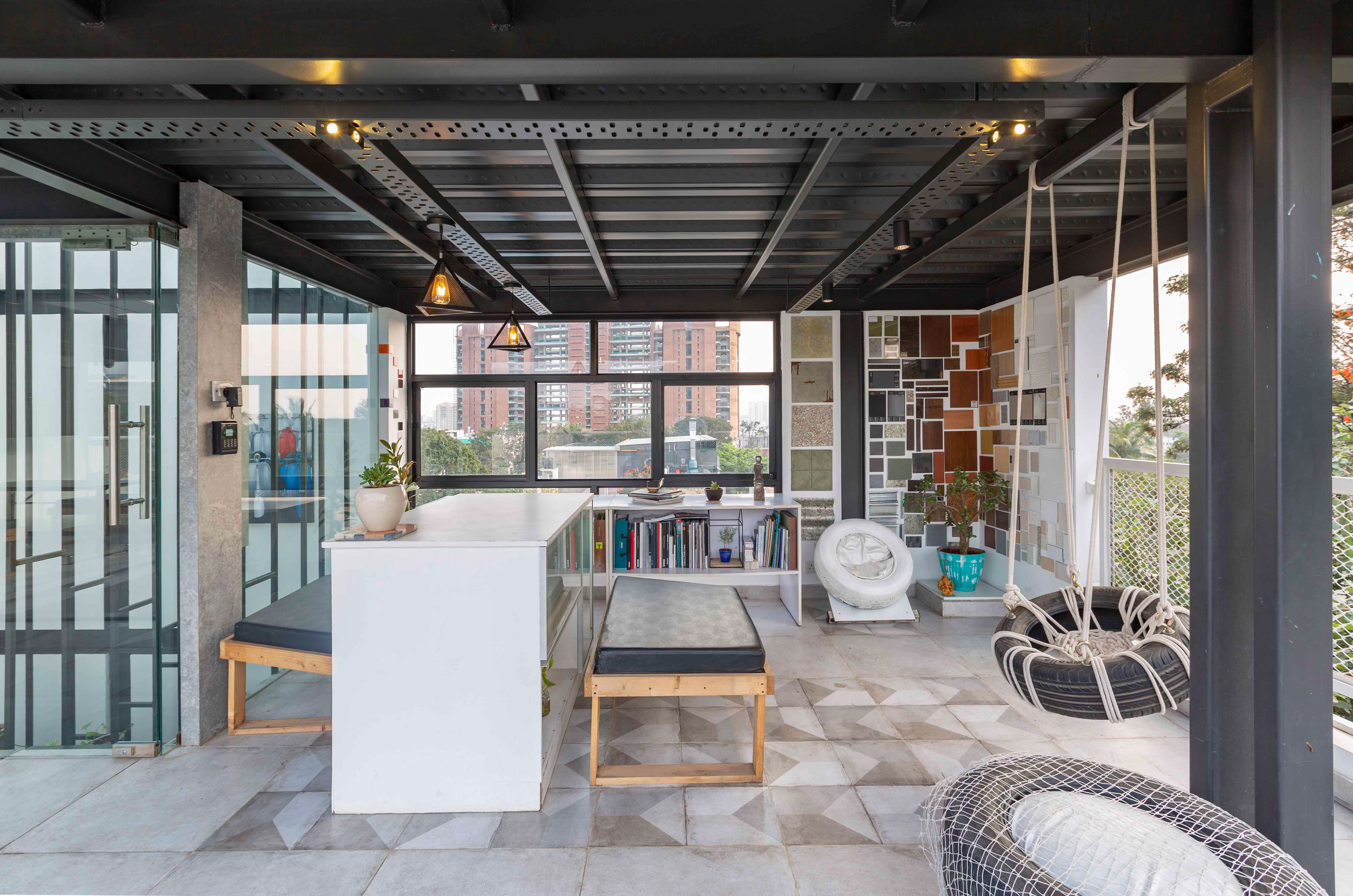 The breakout zone also features a material interactive wall with up-cycled informal seating that is used during client meetings