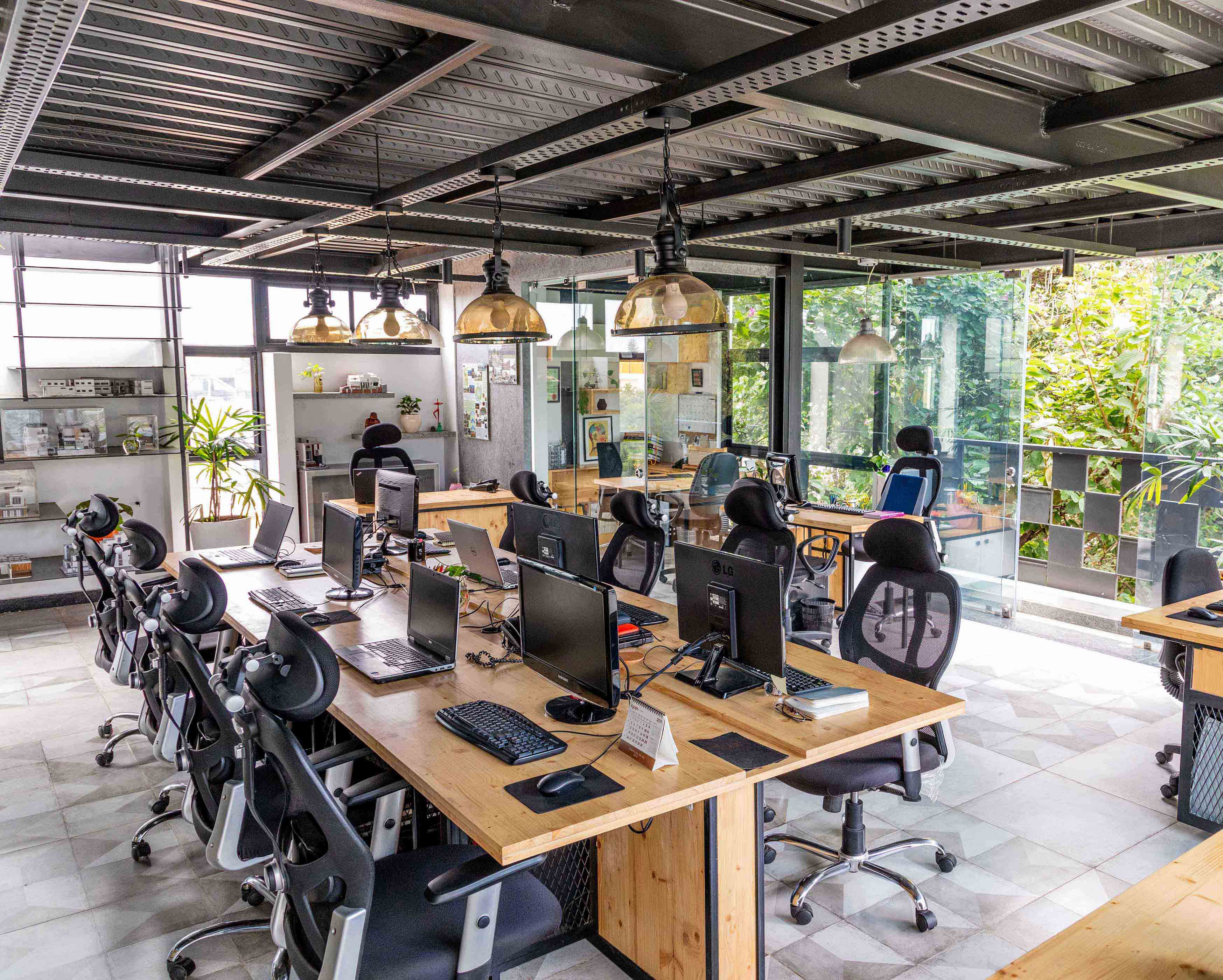 The park facing, flexible workspace has large openings that allow natural light to pour in, green elements around the office makes for an informal and stress-free work environment.