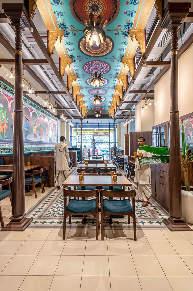 As one walks through the restaurant, they are met various elaborately detailed and embellished features including wooden handicrafts and paintings.