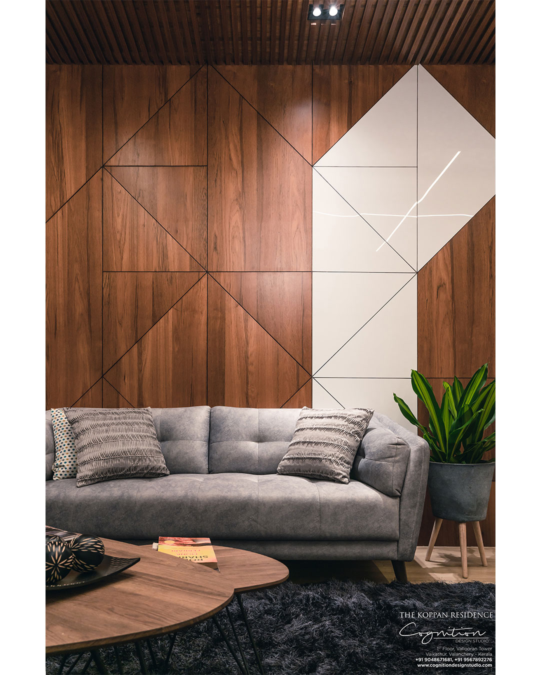 The Formal Living - The wall panel is made up of wood and white acrylic sheets.