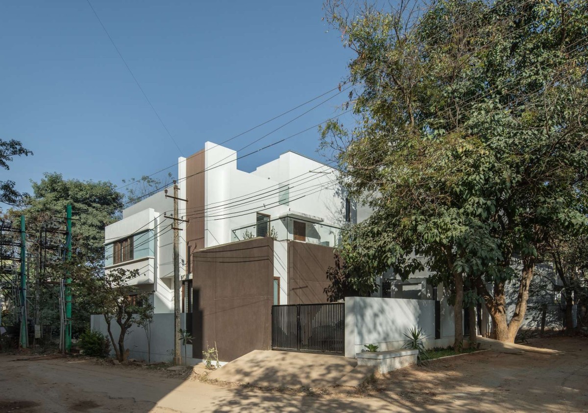 Exterior View Of House With Two Courts By Shuonya Nava Designs
