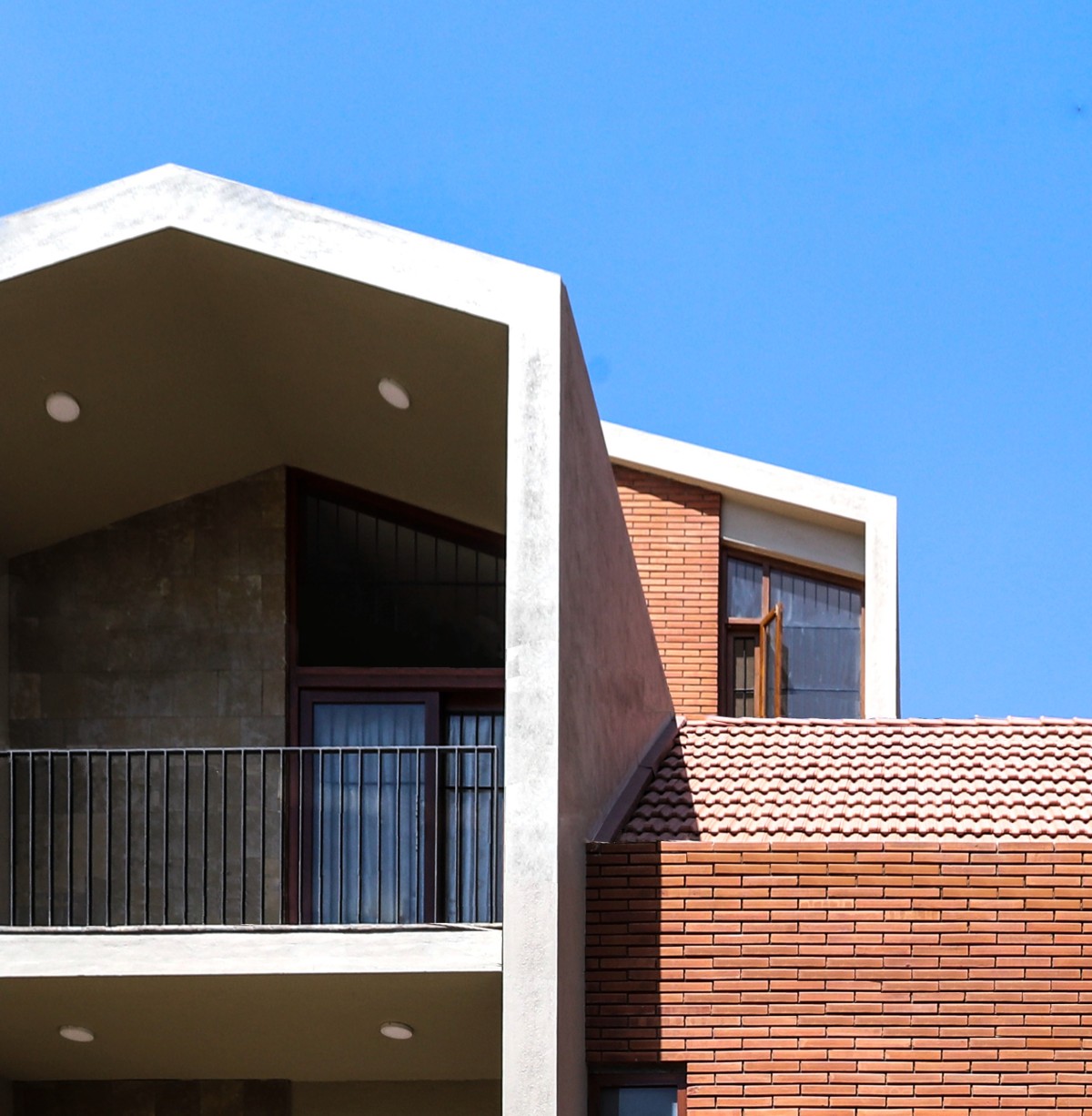 Exterior View Of Pitched House by Kamat & Rozario Architecture