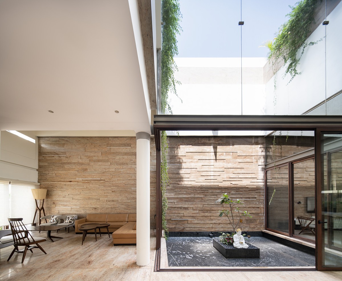 Living and courtyard view of Residence 568 by Charged Voids