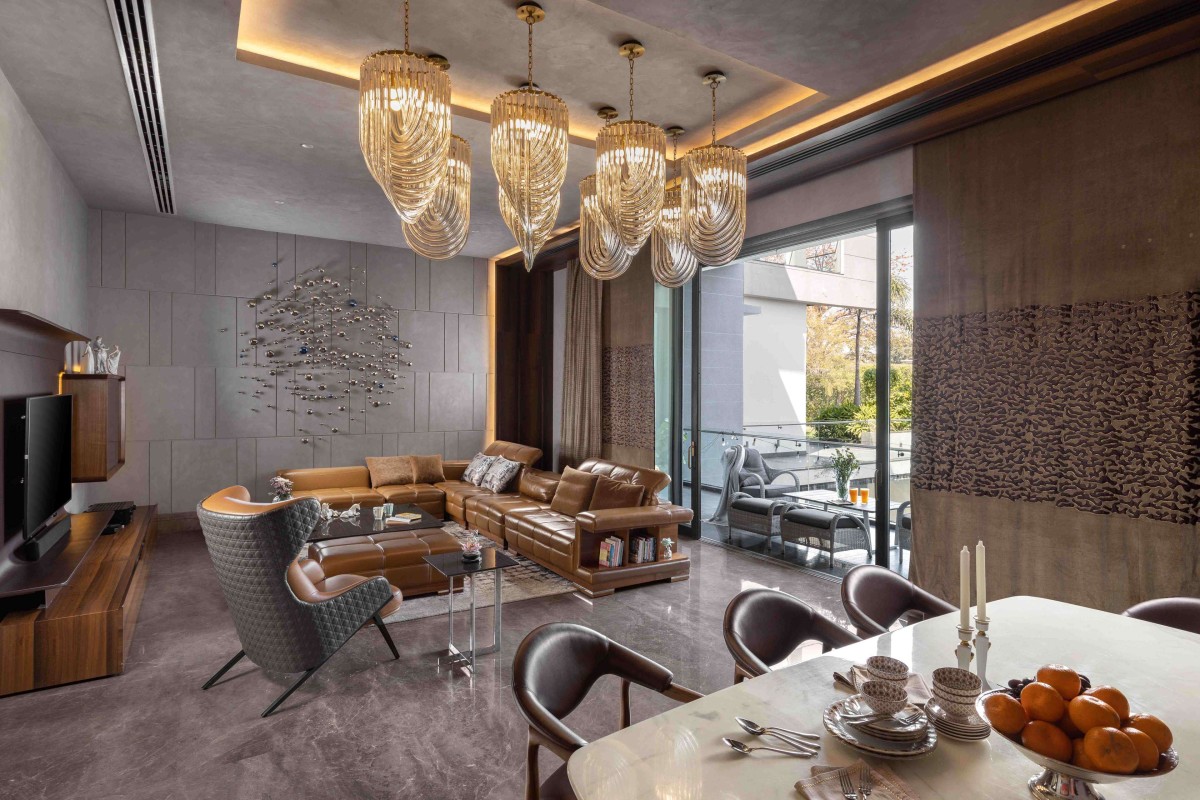 Living room and Dining room of Chattarpur Villa by Design Deconstruct