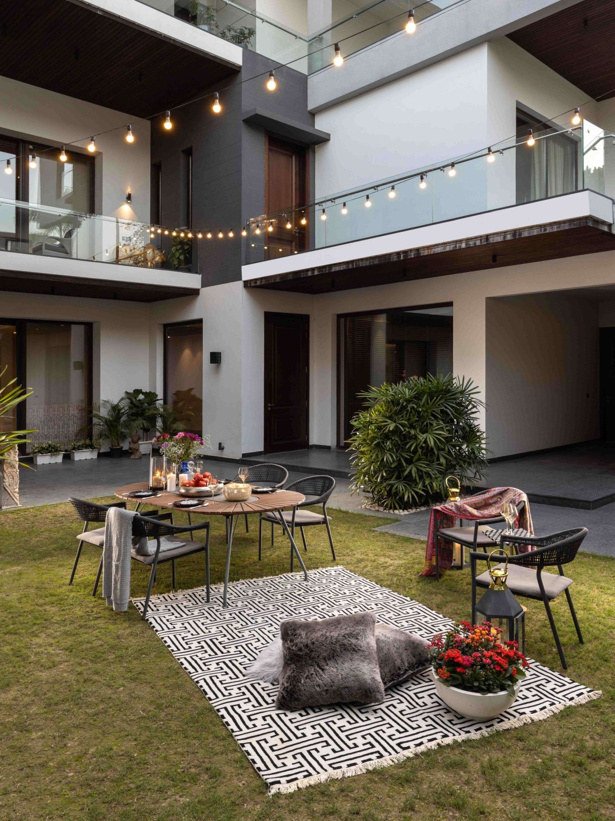 Outdoor seating of Chattarpur Villa by Design Deconstruct