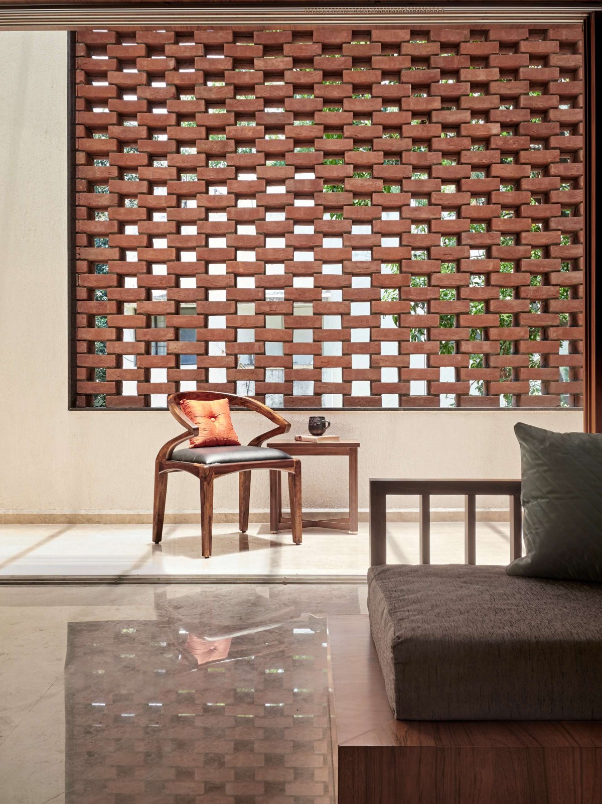 Multi-purpose room - Brick perforated wall of The Brick Abode by Alok Kothari Architects