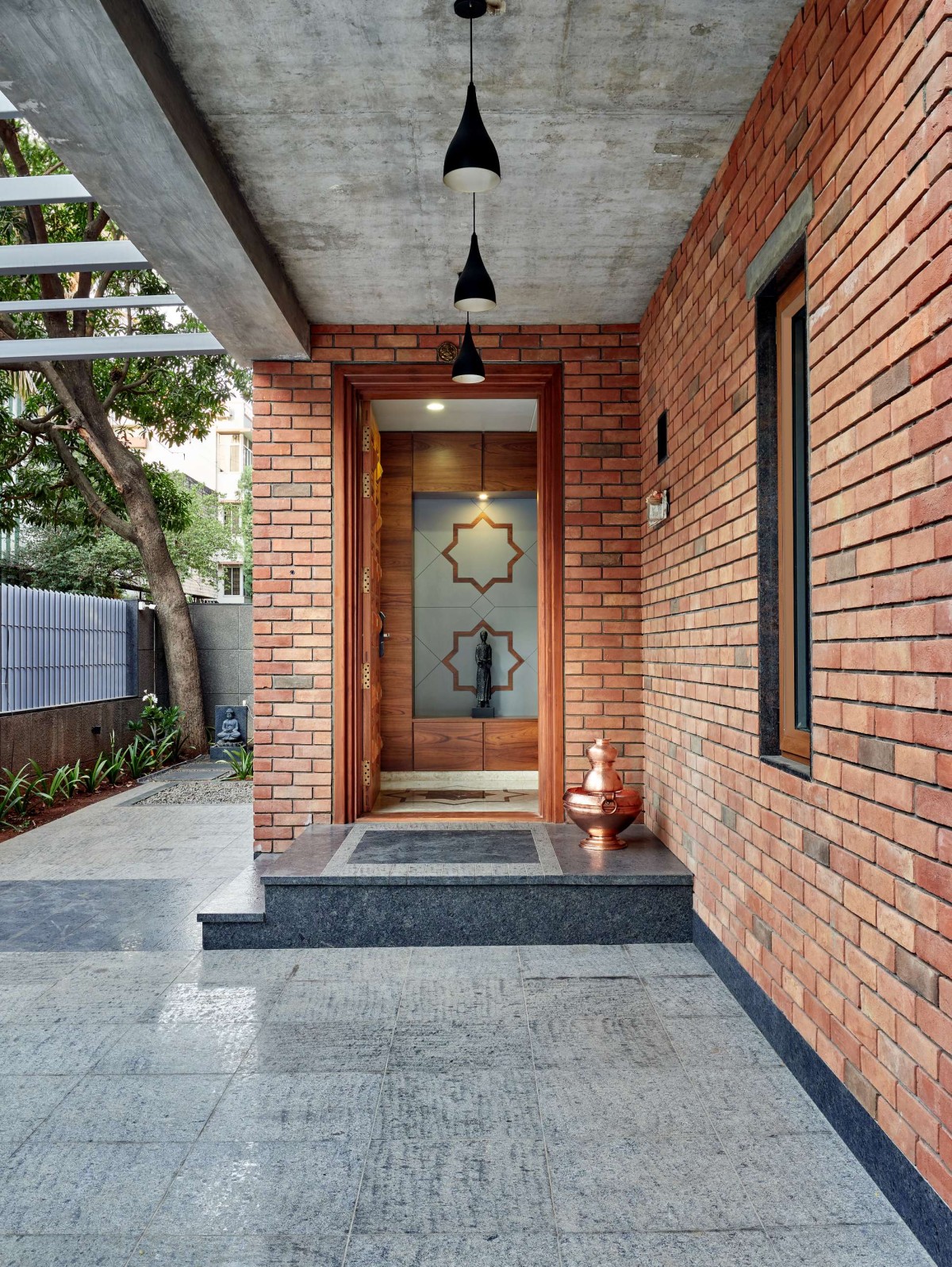 Porch + Entrance Lobby of The Brick Abode by Alok Kothari Architects