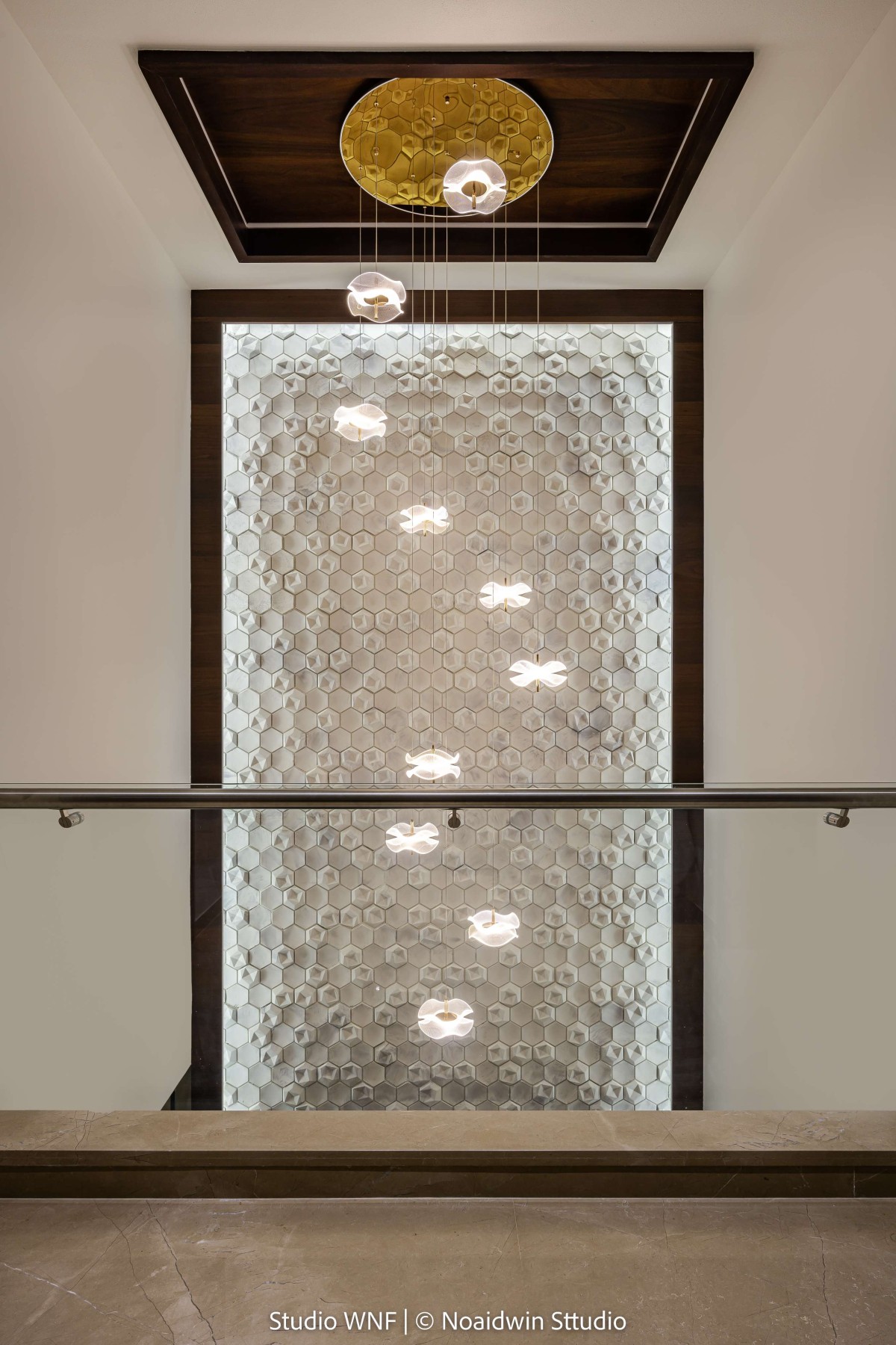 Detailed shots of Chandelier and wall art of Aakash by Studio WnF