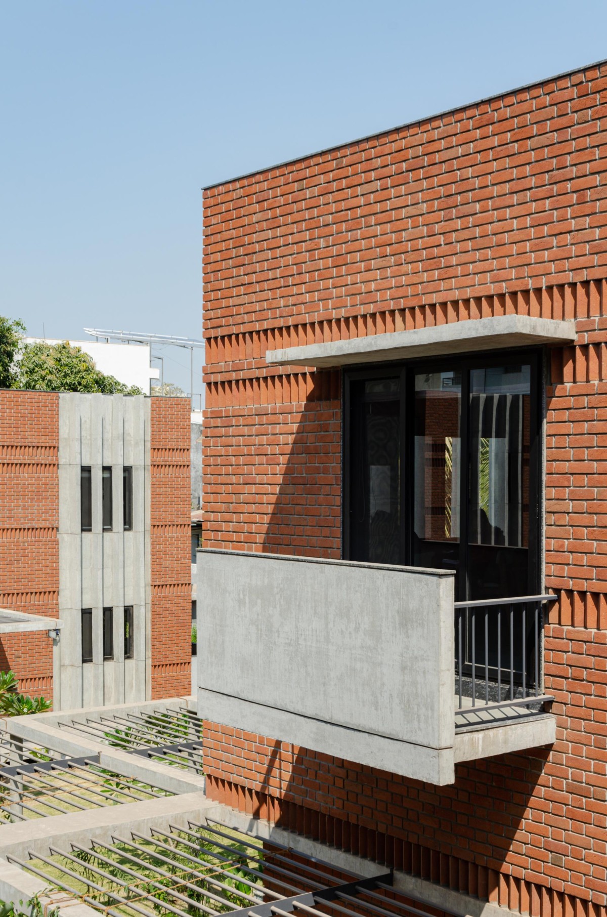 Detailed shot of exterior view of Chitrakut - An Extended Family Cluster (Faliyu) by Aangan Architects
