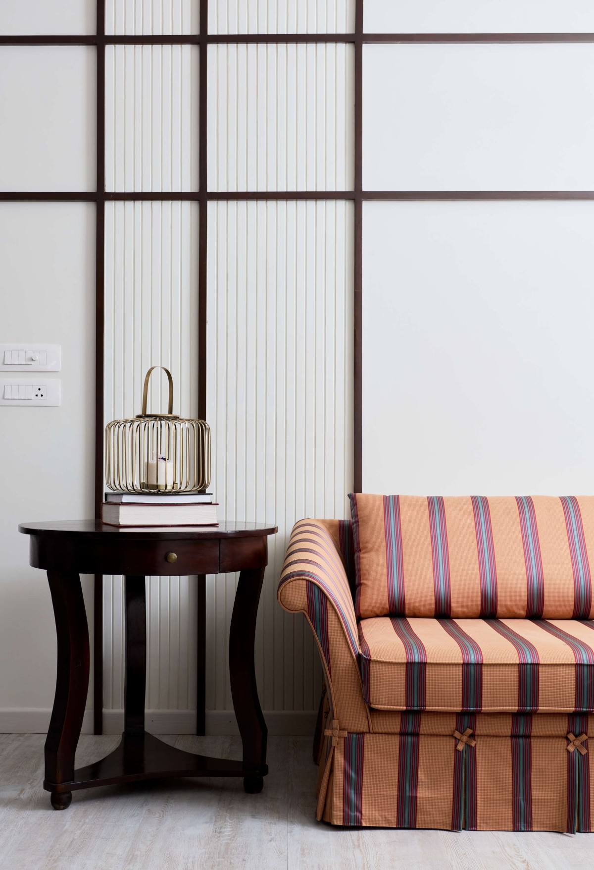 Detailed shot sofa and furniture at living room of Casa De Primrose by Space Karma Design Studio