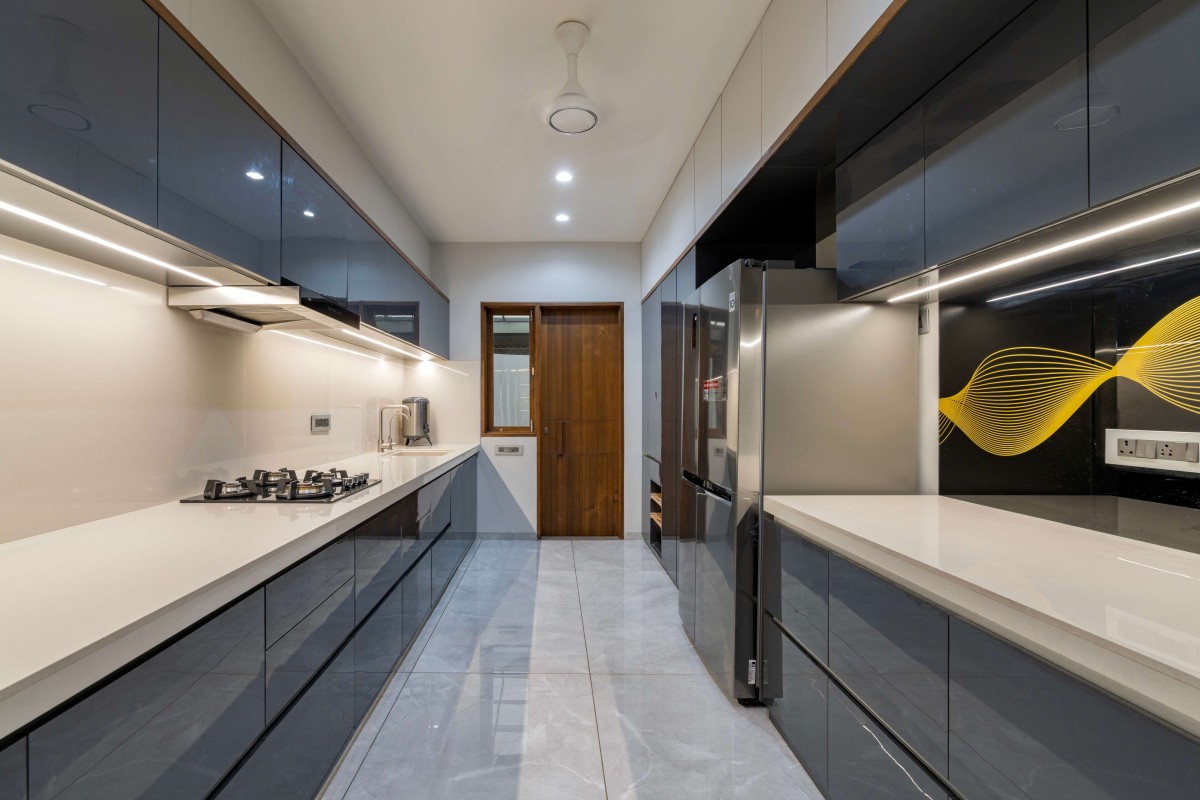 Kitchen of An Amiable Enclave Of Sharnam 7 by Anand Patel Architects