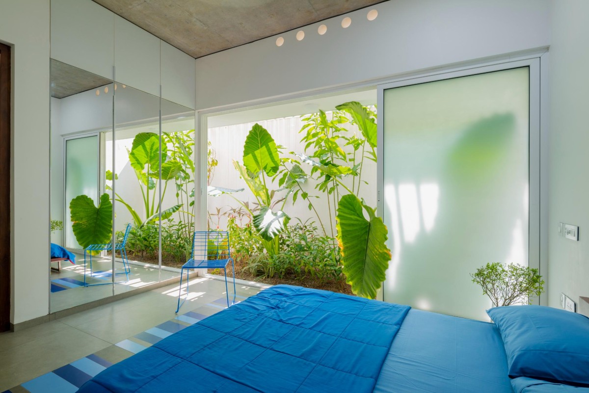 Ground Floor Blue Bedroom of The House That Rains Light by LIJO.RENY.Architects