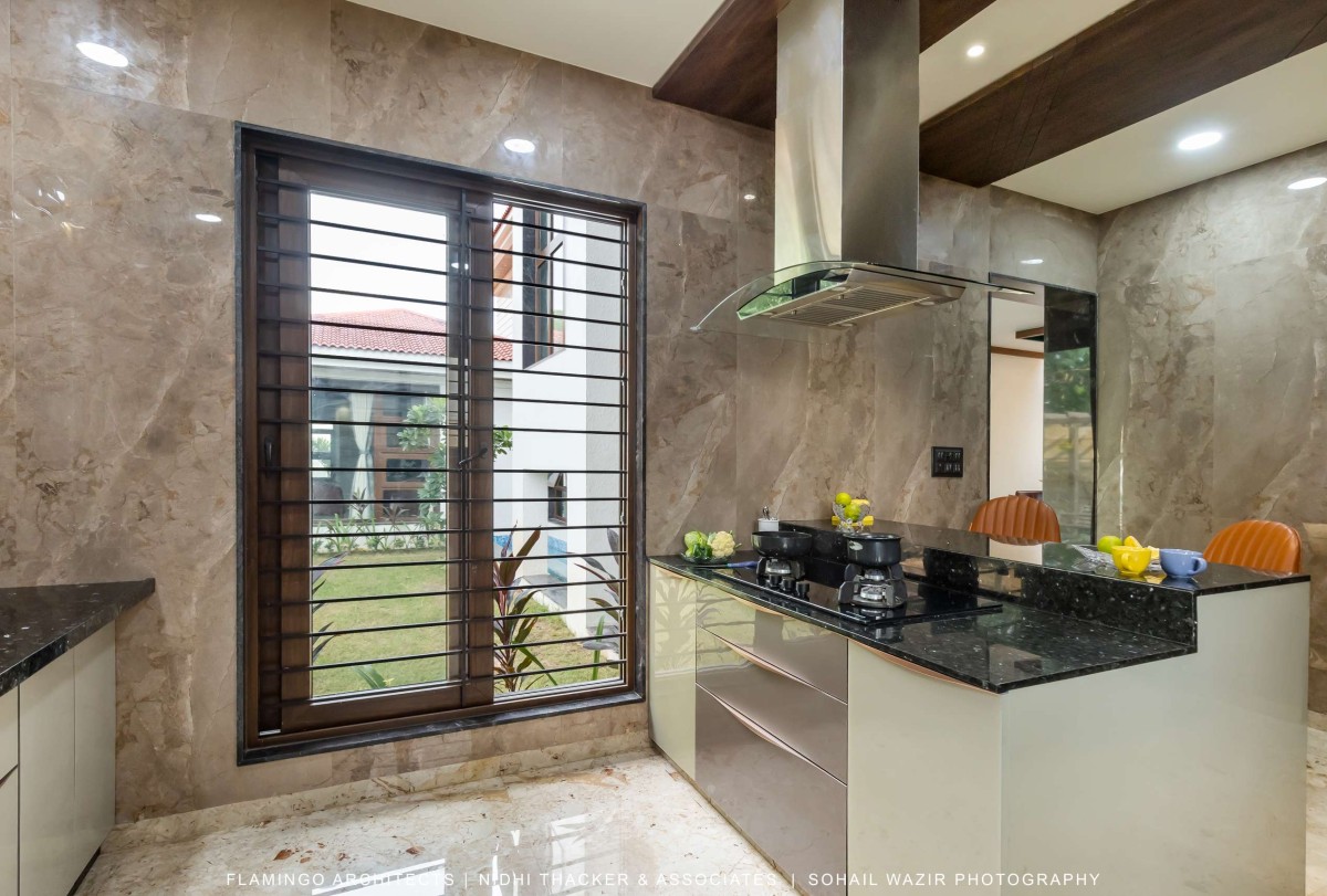 Kitchen of Pujara House by Flamingo Architects + Nidhi Thacker and Associates