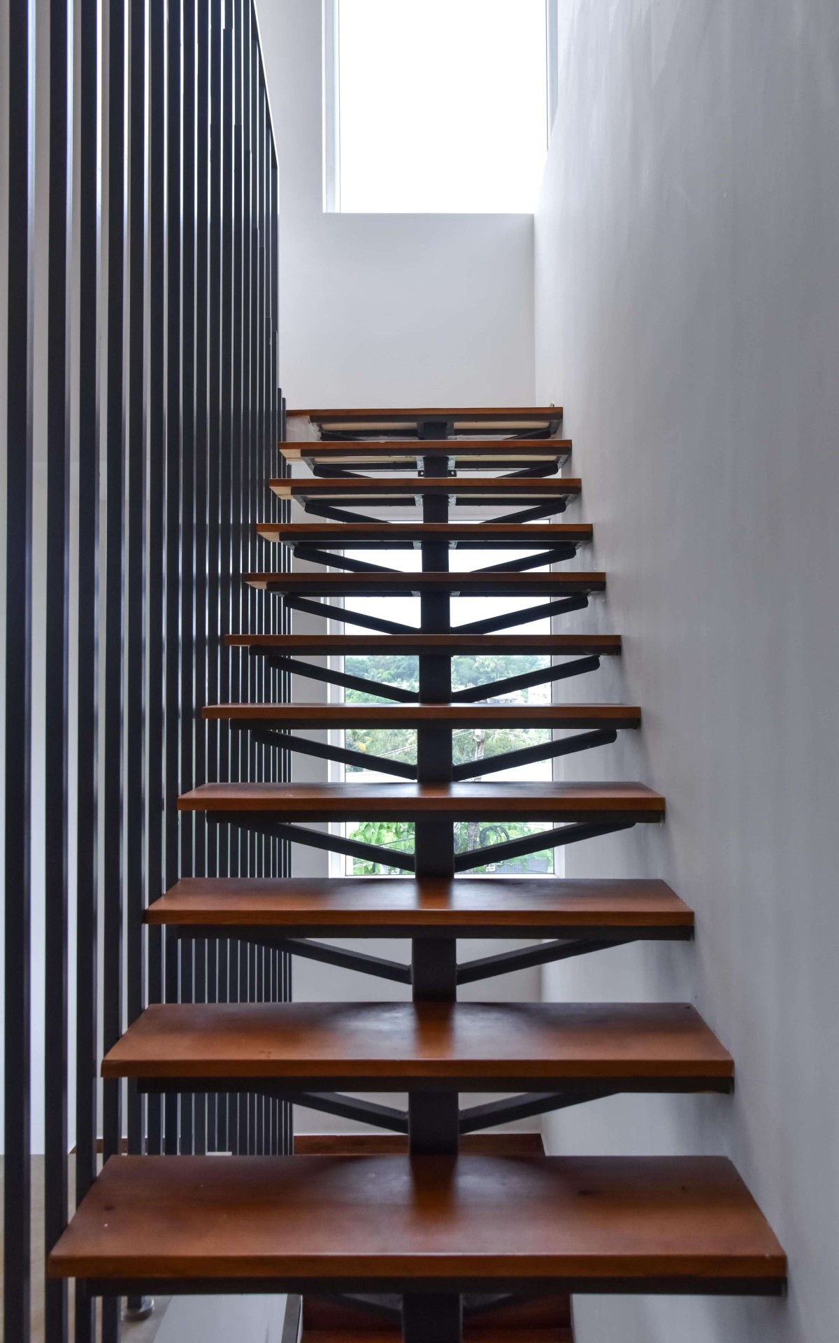 Staircase of The N’Arrow House by Designloom Architects
