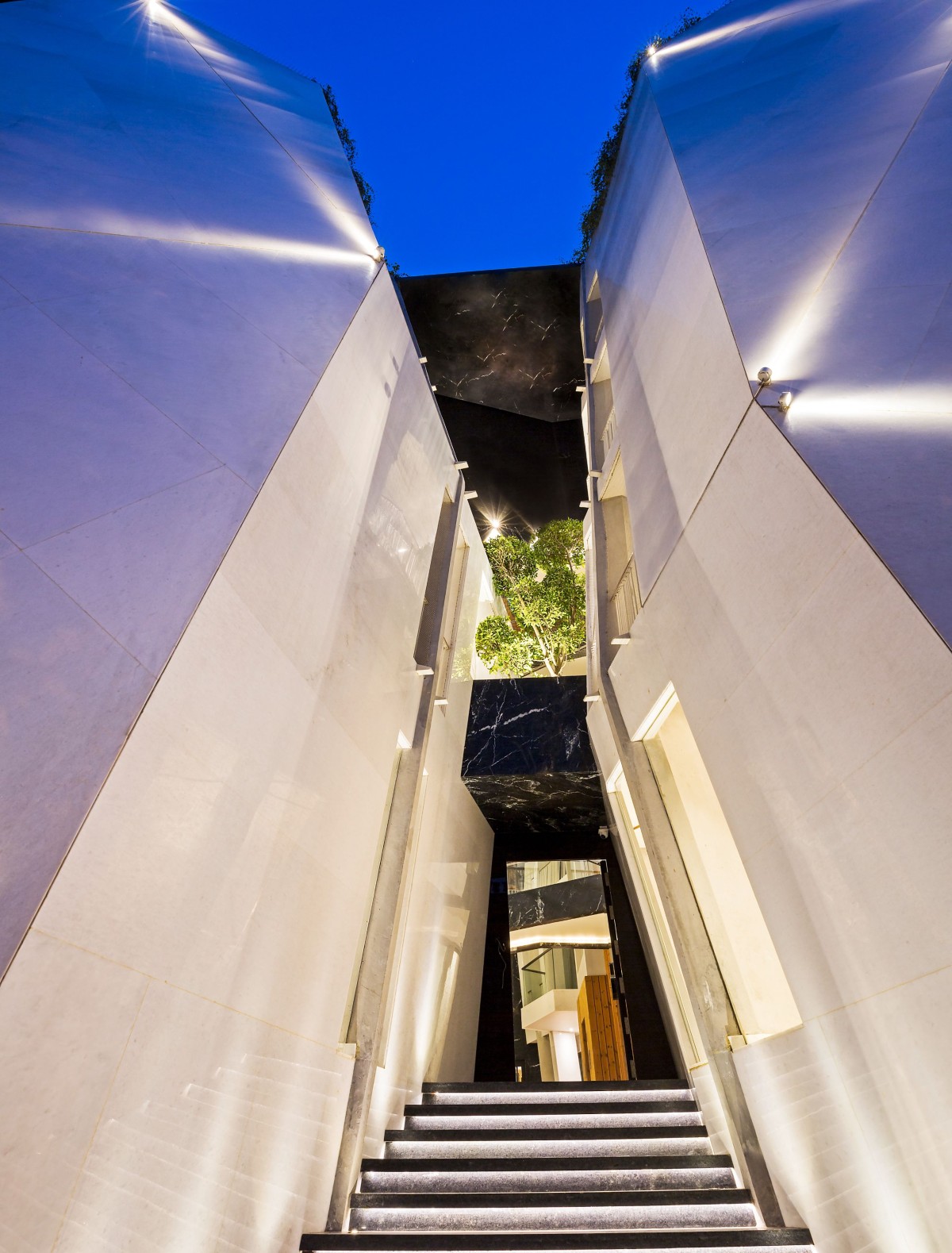 Entrance through the converging enclosures of Cleft House by Anagram Architects