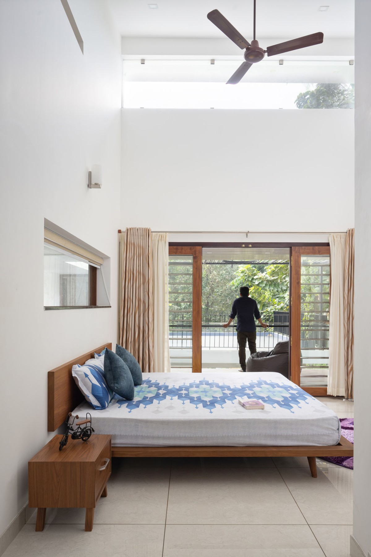 Bedroom 2 of The Frangipani House by Designature Architects
