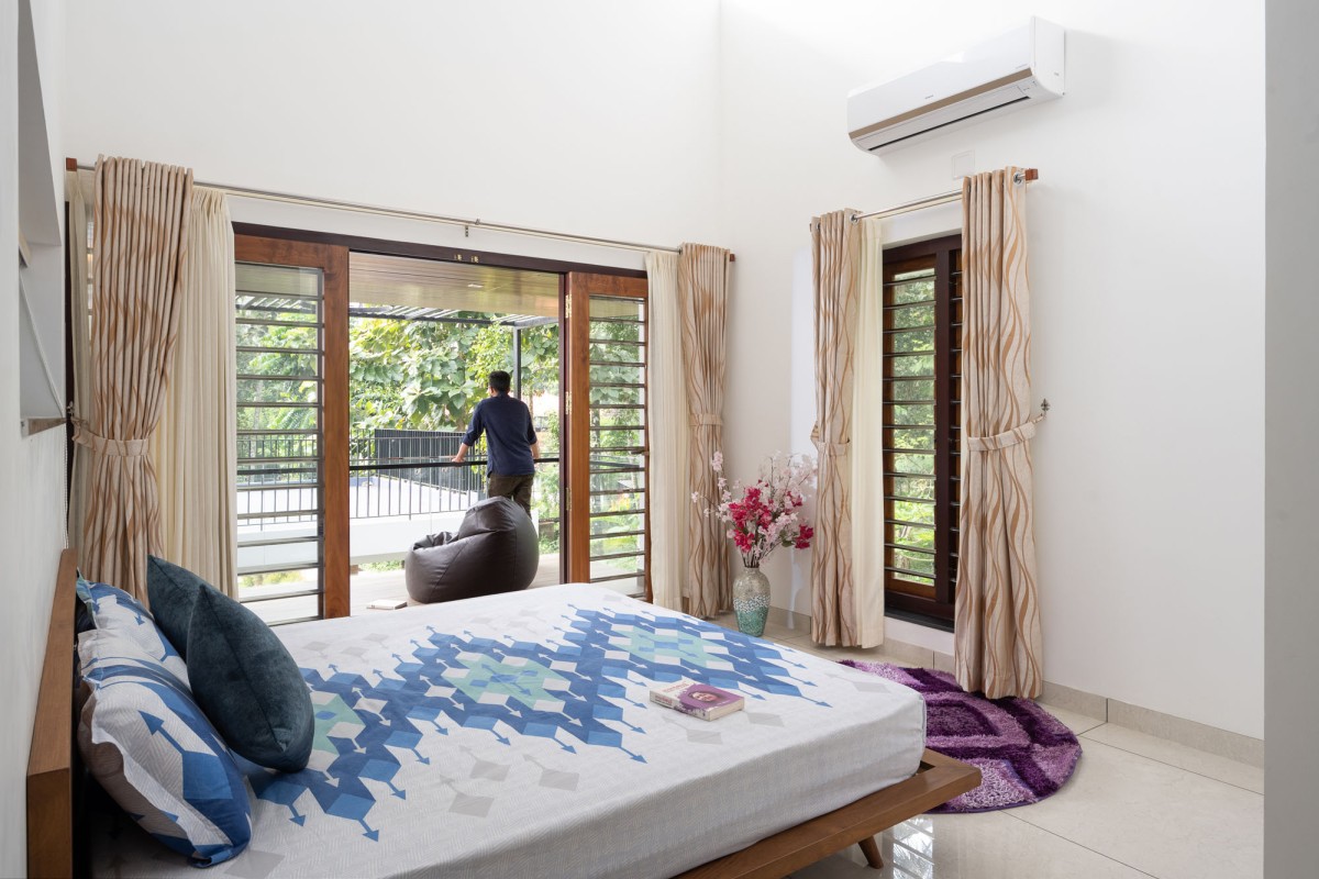 Bedroom 2 of The Frangipani House by Designature Architects