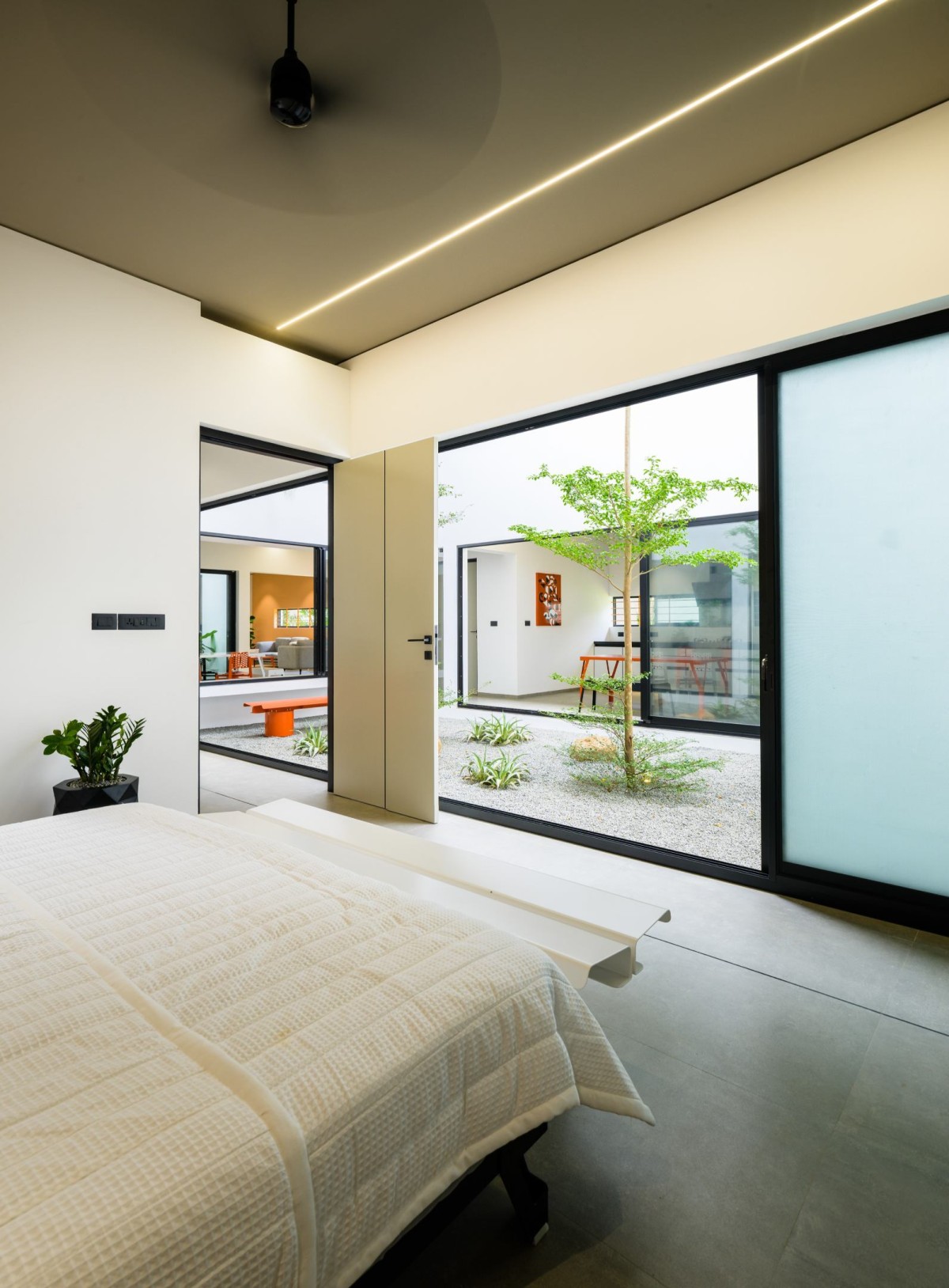 Bedroom 1 of The Colour Burst House by LIJO.RENY.architects