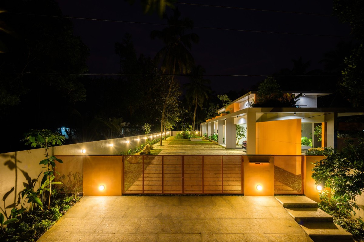 Exterior Dusk view of The Colour Burst House by LIJO.RENY.architects