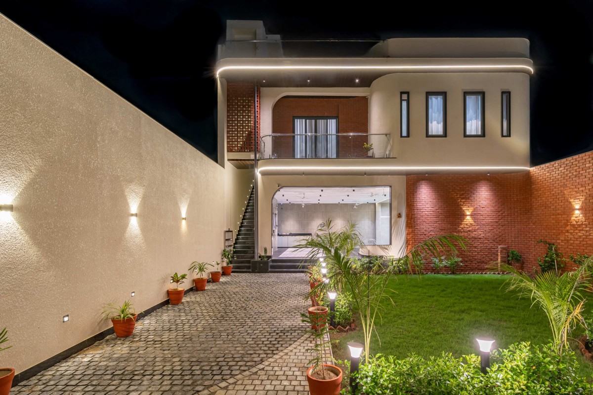 Night shot of exterior view of Weekend Villa by On The Dot