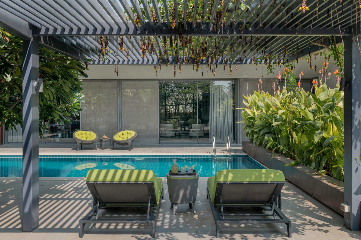 Swimming pool view of House Of Greys by ADND
