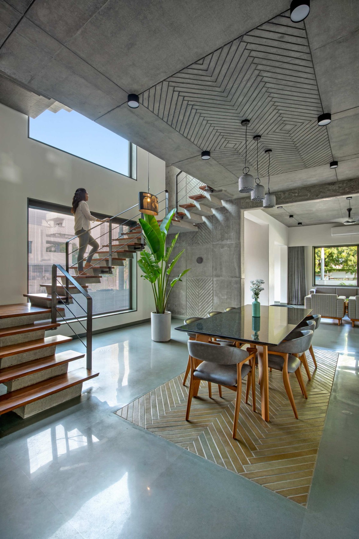 Dining Area and Staircase of Royal Acre Residence by K.N. Associates