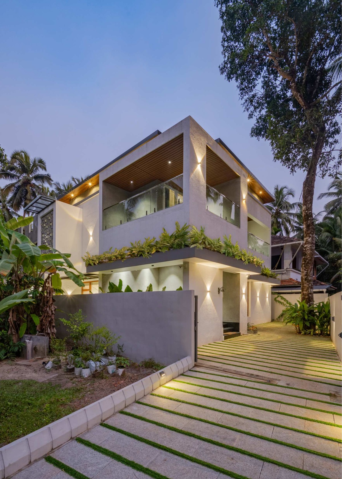 Facade-night view of The Pravasi Home by Studio Vista Architects