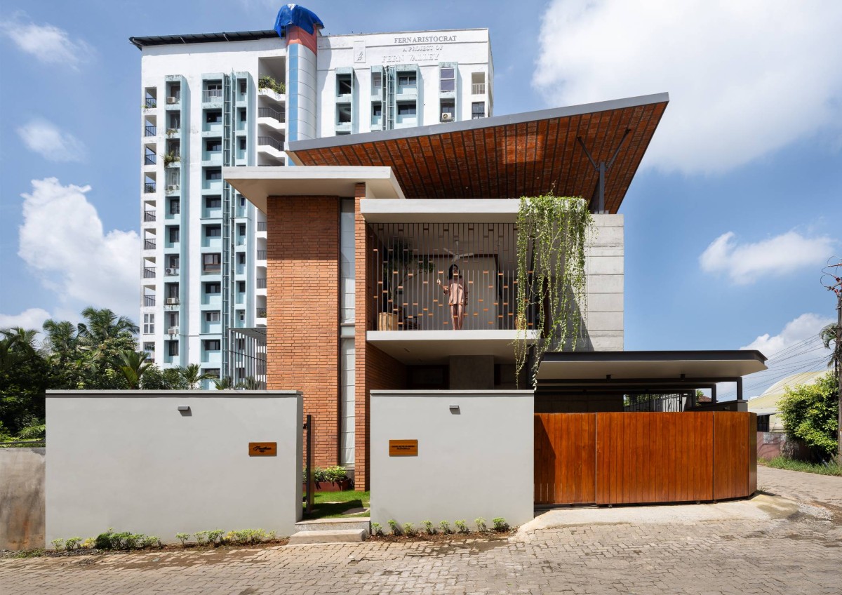 Exterior view of Carving a COURT OF QUIETUDE in a Bustling Cityscape by Mudbricks Architects