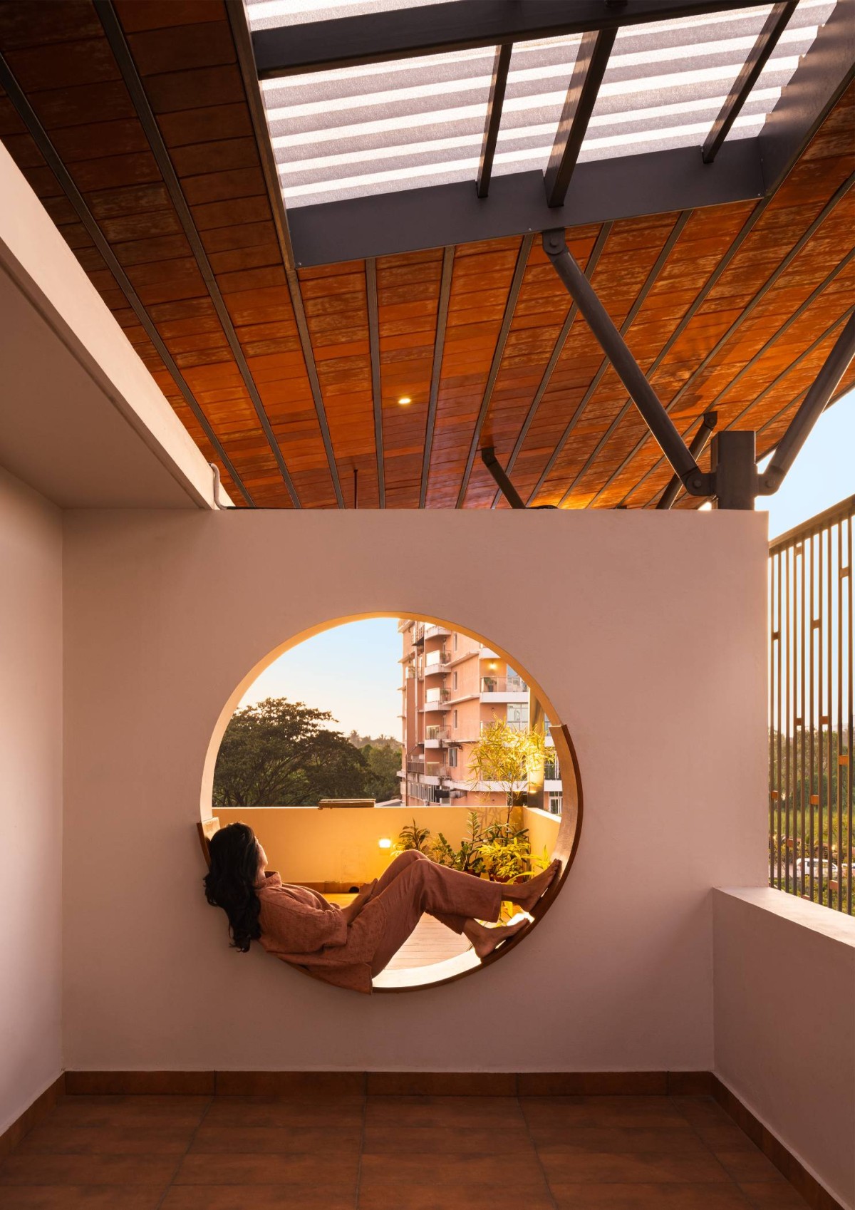 Balcony of Carving a COURT OF QUIETUDE in a Bustling Cityscape by Mudbricks Architects