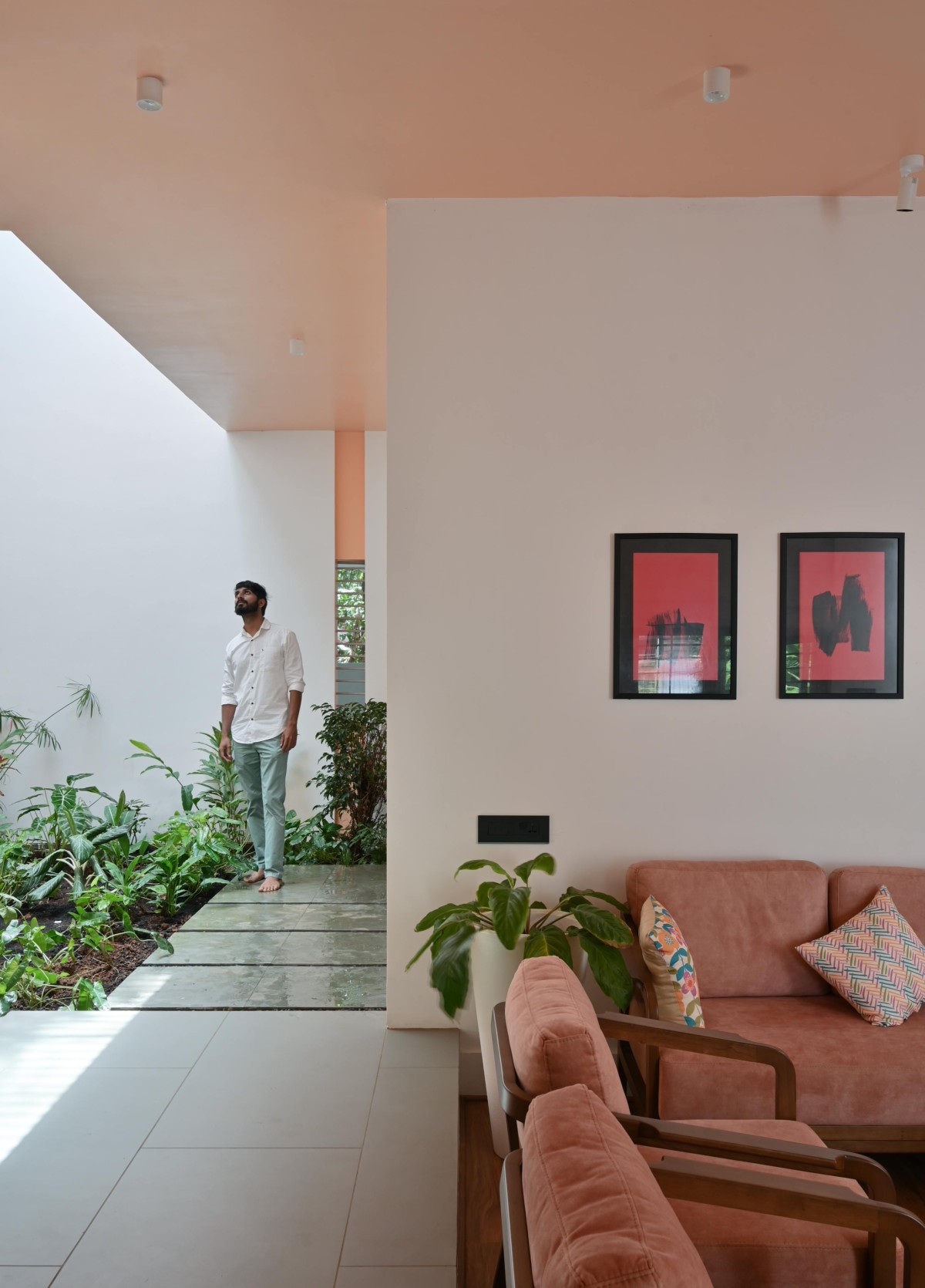 Passage between Courtyard and Living room of The Peachy Affair by Monsoon Projects