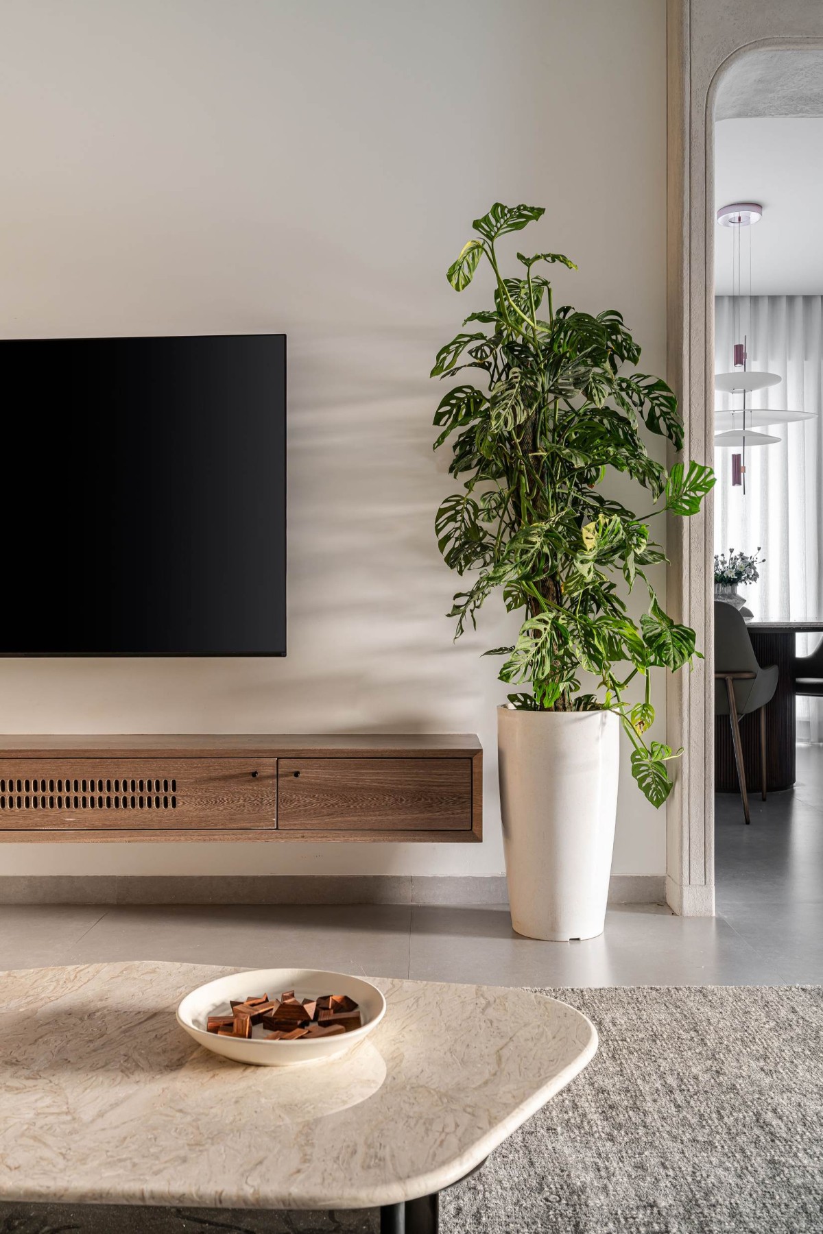 TV Unit at living room of Greige House by LADLAB