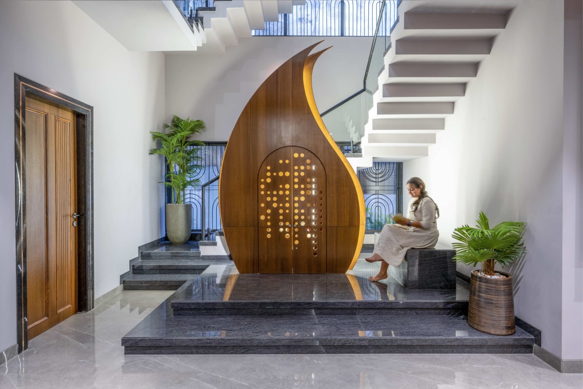 Pooja room and Staircase of Brick House by Patel Bhavin Architects