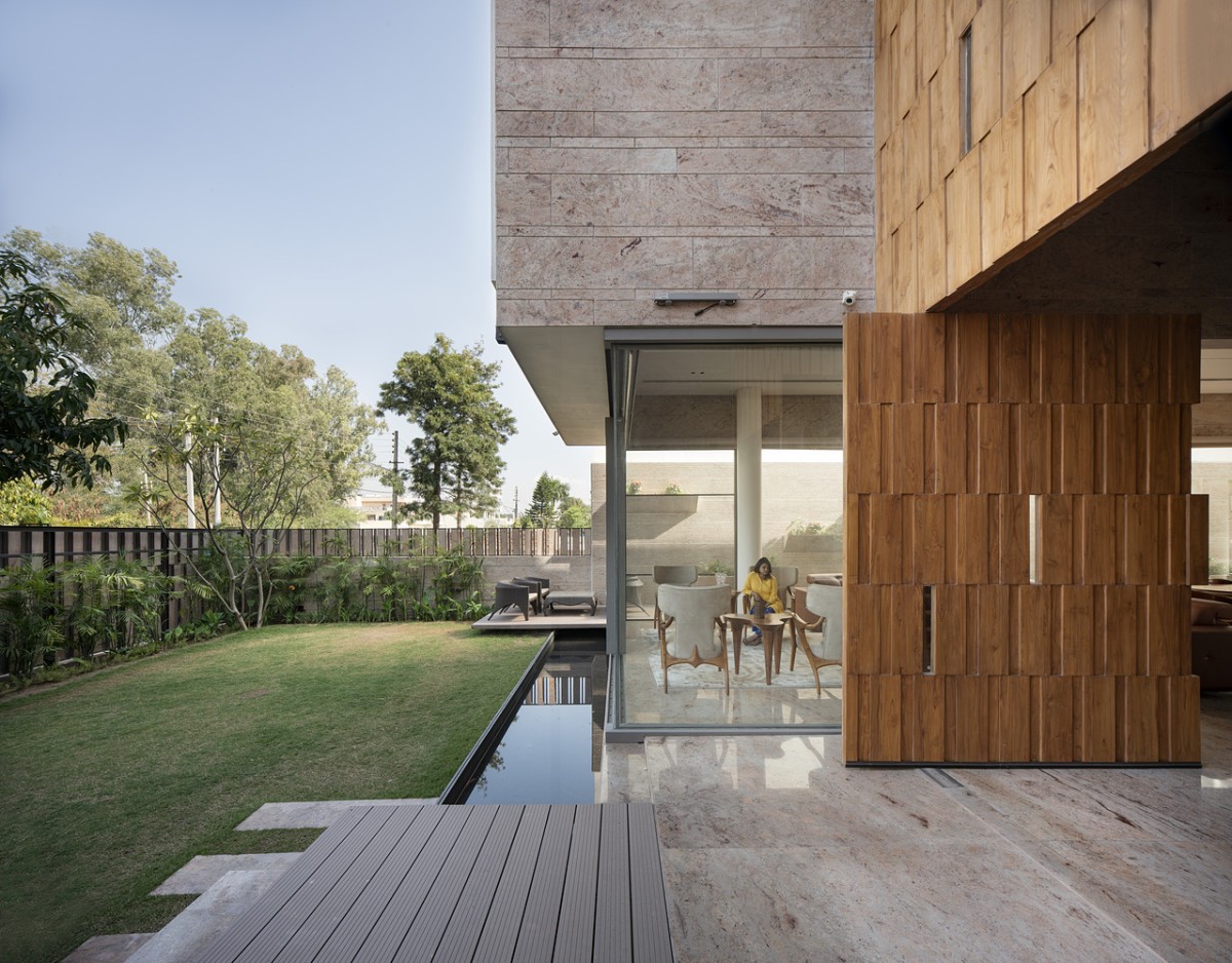 Wooden Deck and Lawn of Residence 35 by Charged Voids