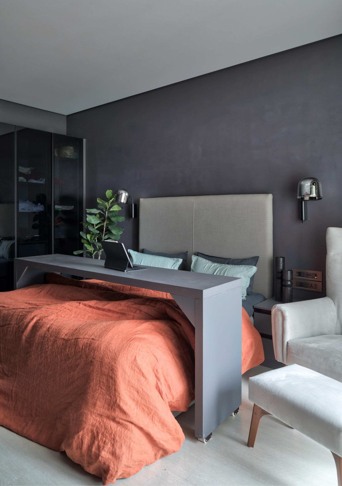 Master bedroom of Ashram Row House 101 by Karan Desai Studio Architecture + Design