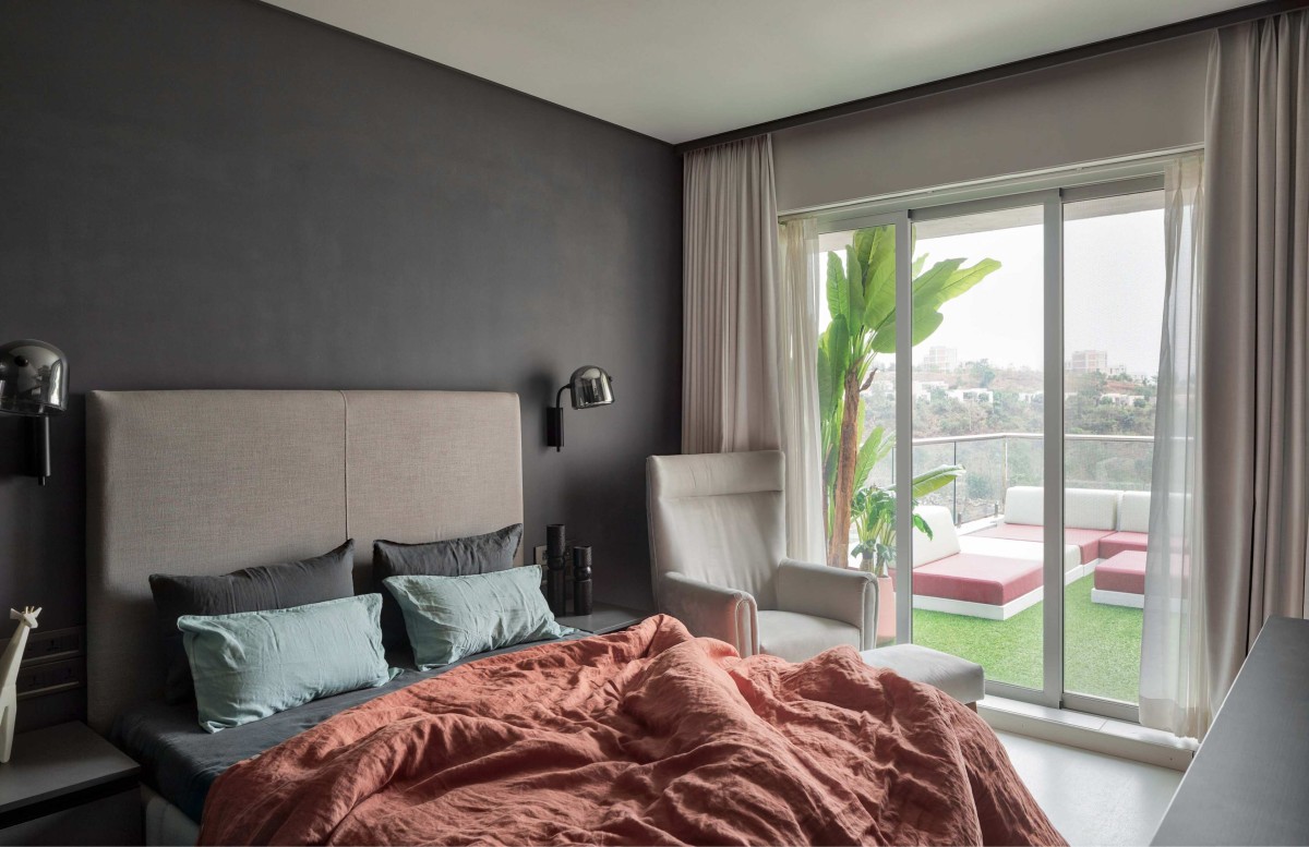 Master bedroom of Ashram Row House 101 by Karan Desai Studio Architecture + Design