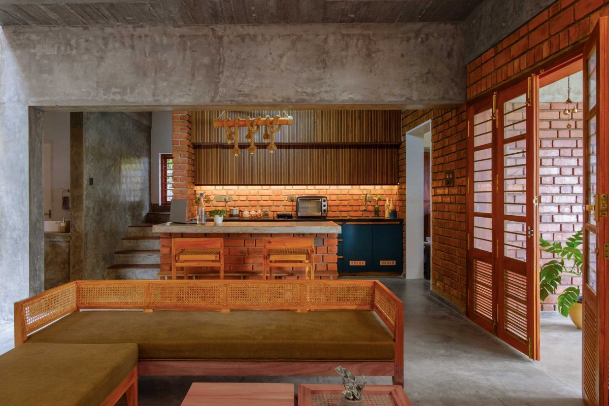 Living and Kitchen of Akam by Ishtika Design Studio
