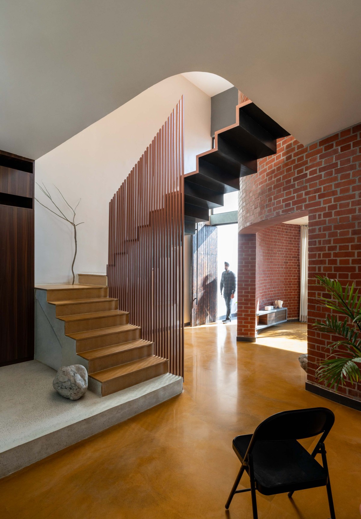 Living and Staircase of Perennial House by Sifti Design Studio