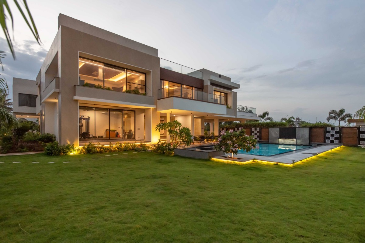 Dusk light exterior view of The Tropical Beach House by Inventarchitects