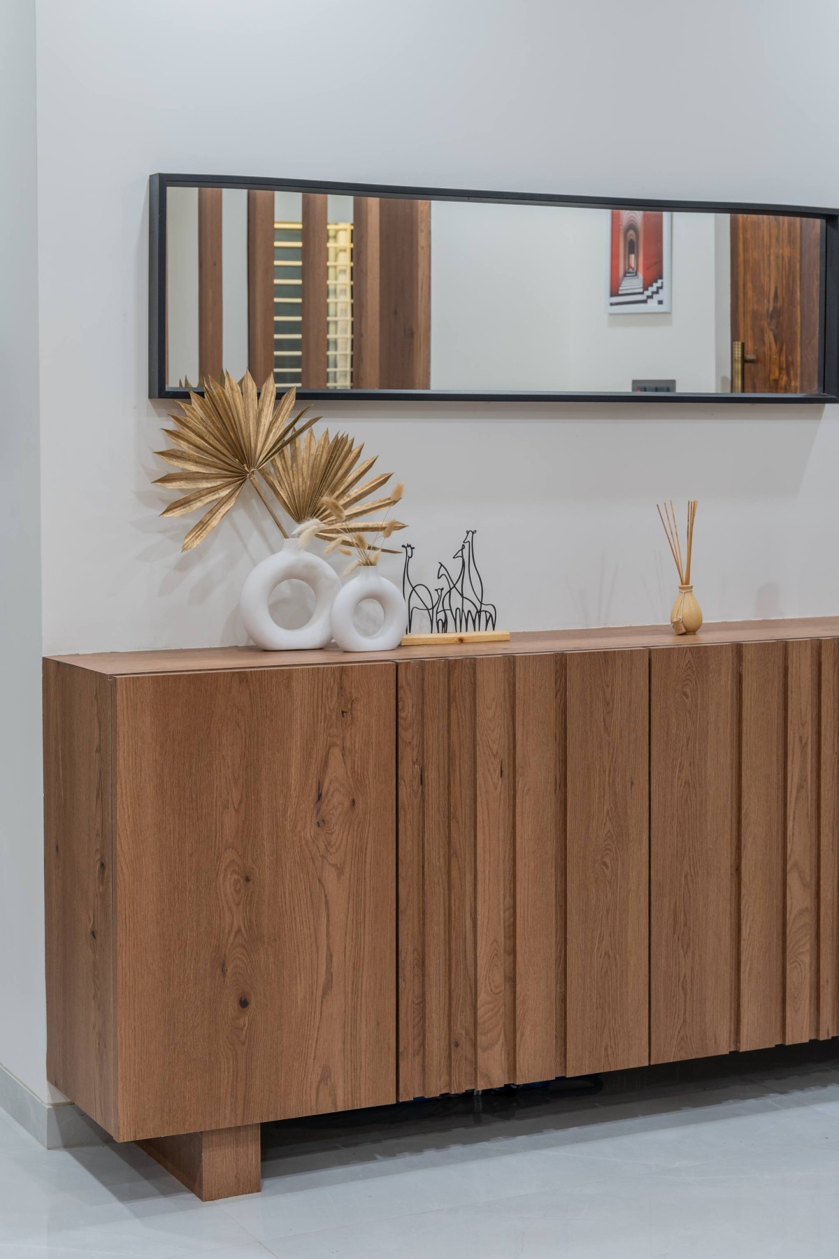 Foyer console featuring series of linear line of Sukoon by the Subtle Studio