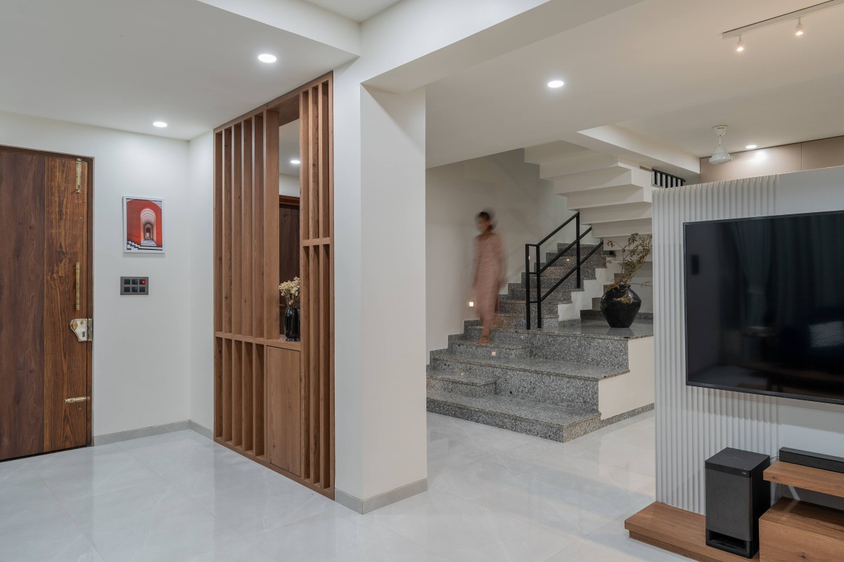 Staircase through foyer and living area of Sukoon by the Subtle Studio