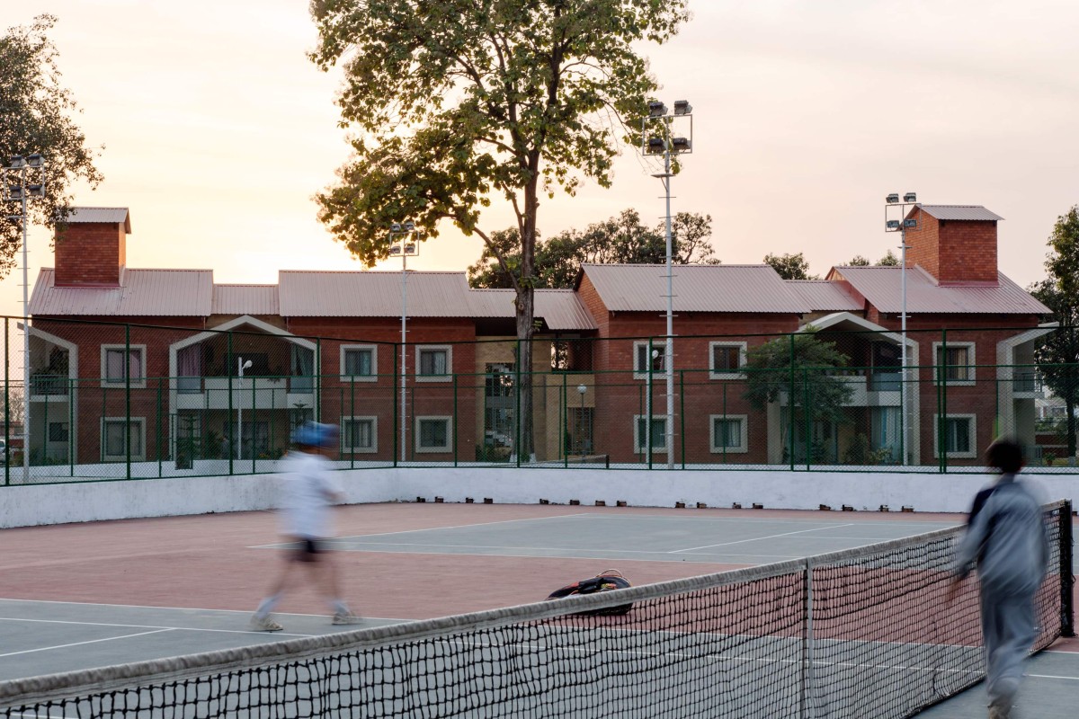 Tennis Court in front of Teacher's Residences at The Doon School by Anagram Architects