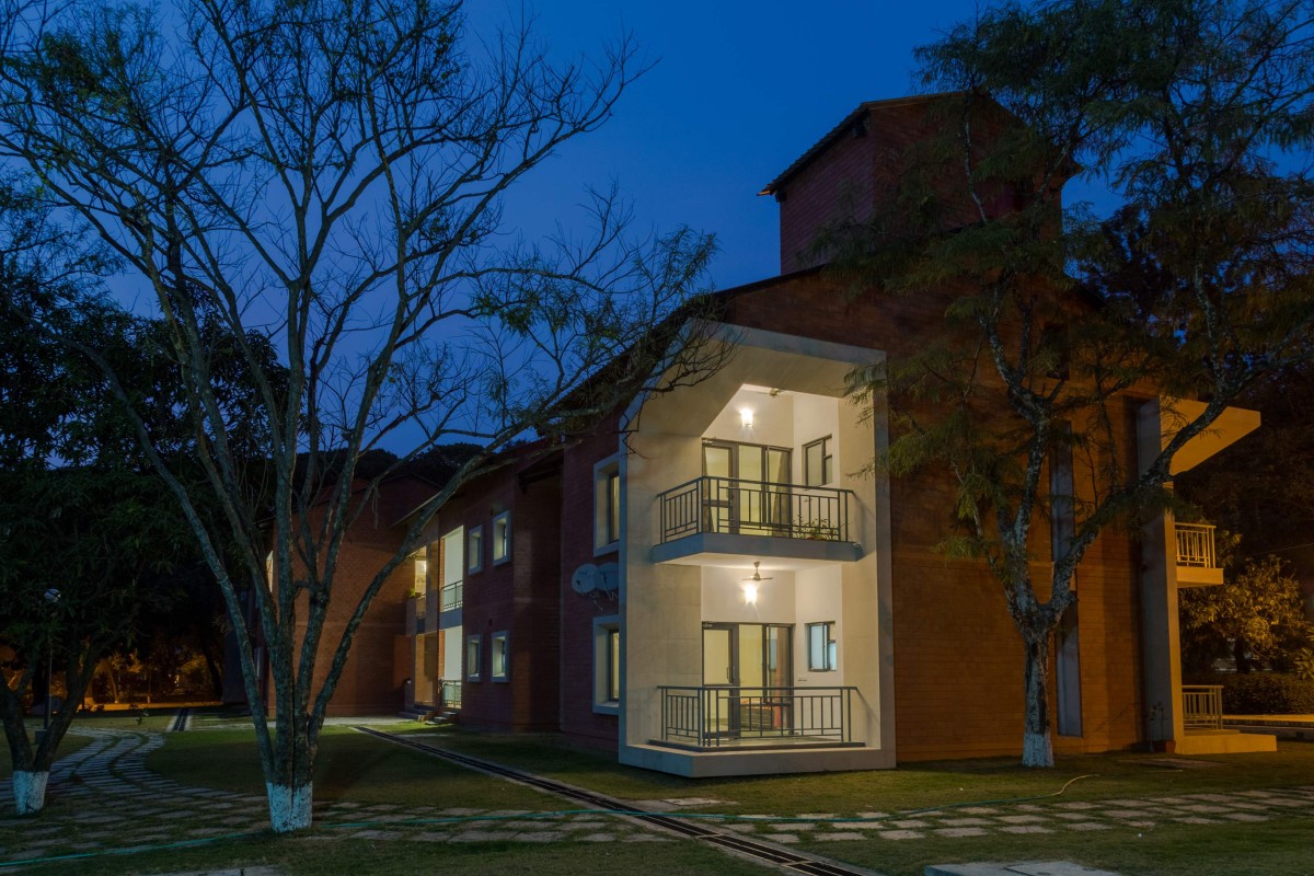 Night shot of exterior view of Teacher's Residences at The Doon School by Anagram Architects