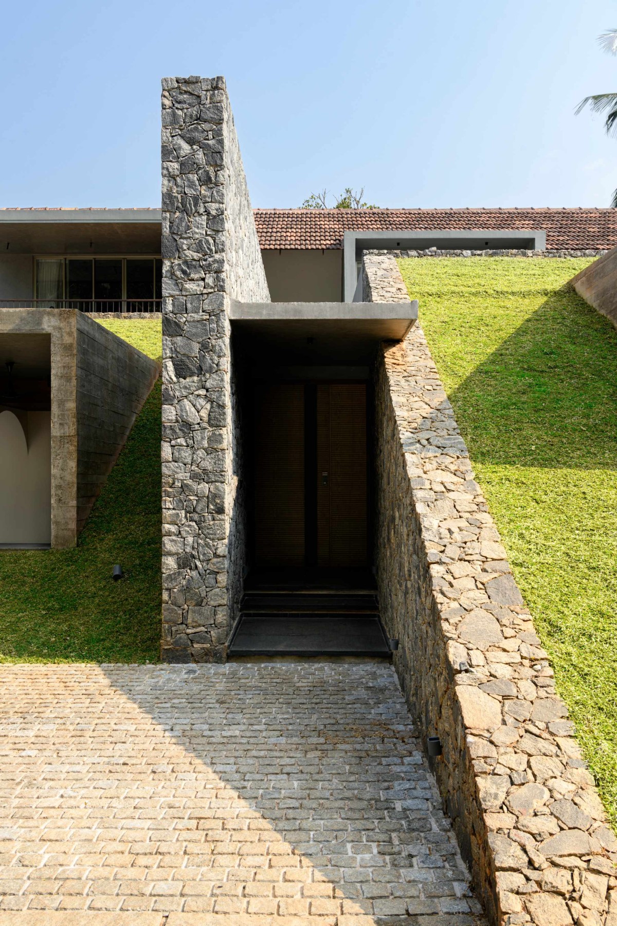 Entrance of The Hidden House by Aslam Sham Architects