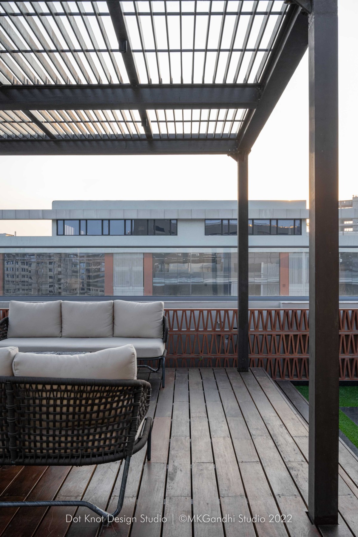 Seating area at terrace of Chic Corporate Office by Dotkot Design Studio