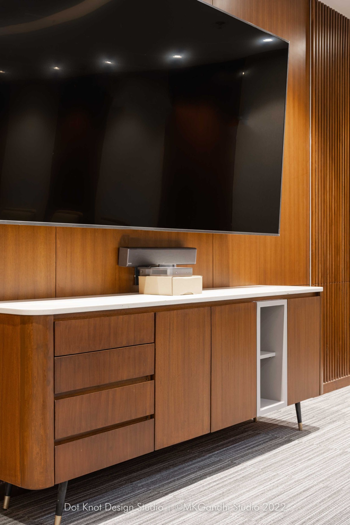 Detailed shot of furntiure and TV Unit of Chic Corporate Office by Dotkot Design Studio
