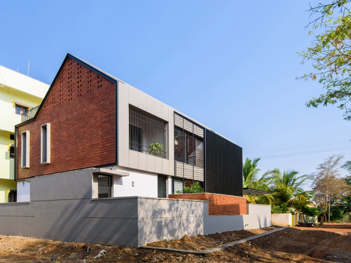 South East view of Corner Brick House by Jacob + Rathodi Architects
