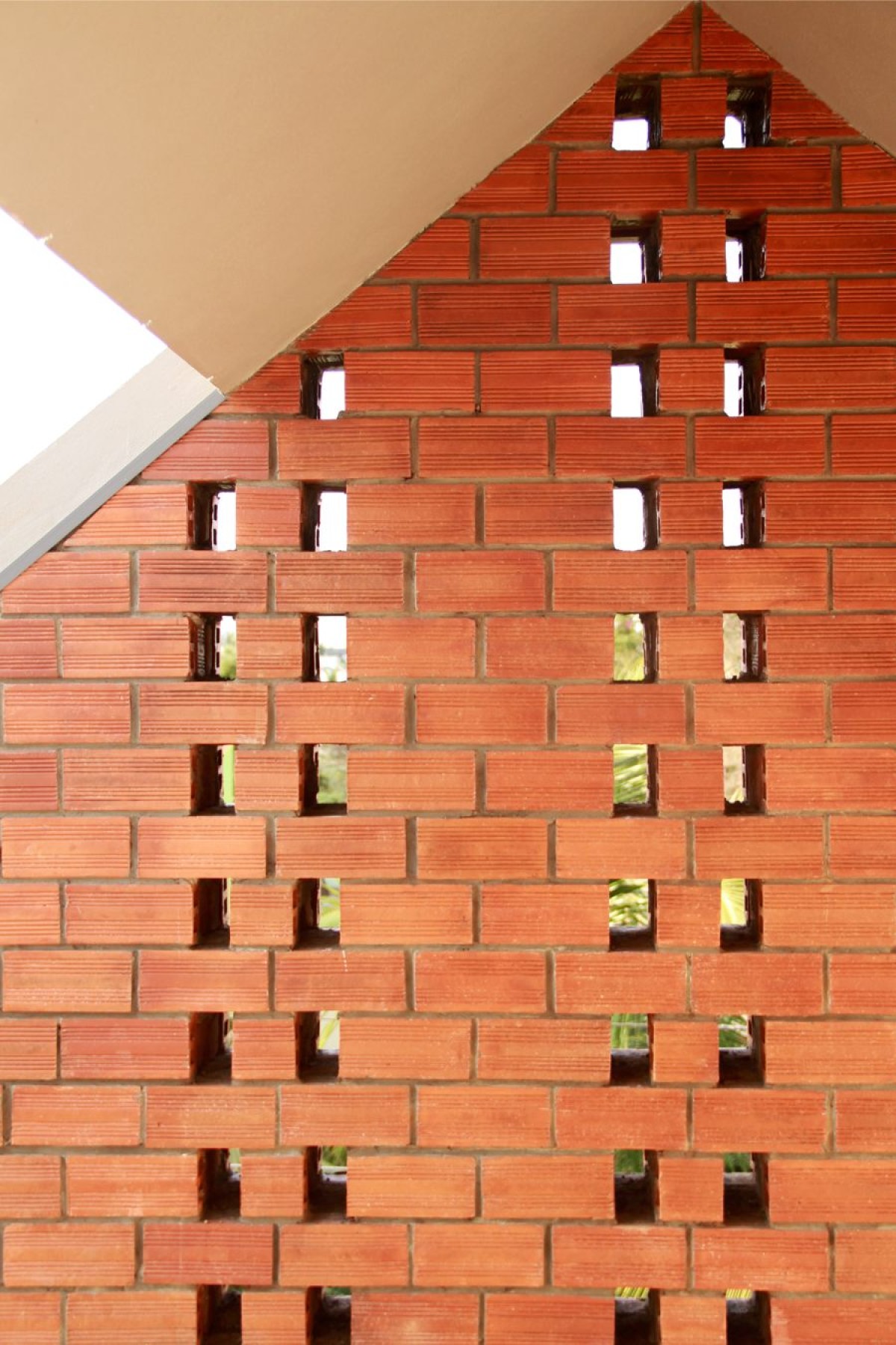 Detailed shot of terrace screen wall of Corner Brick House by Jacob + Rathodi Architects