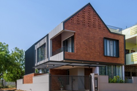 Corner Brick House by Jacob + Rathodi Architects