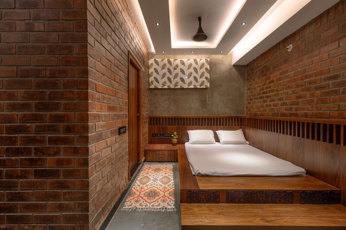Wardrobes made of wood and rattan elements, In-built study desk punctuated with CNC-cut Indian design motifs – Kuteeram by Brick and Compass
